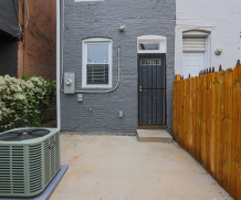 2113 McCulloh Street completed rear elevation — new HVAC, landscaping and exterior finishes